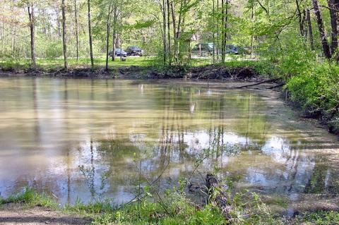 Quarry Pond, a man made feature where much of the stone for the Kirtland Temple was quarried, now filled with groundwater. Notice in this view how square the pond is. Taken in 2003.