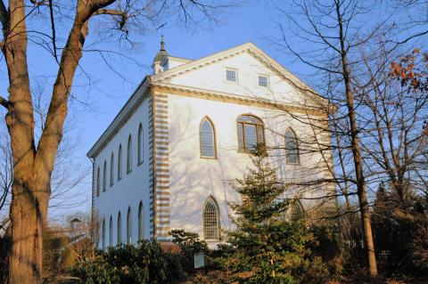 Newer image of the west end of the Kirtland Temple showing the windows of the Prophet's office on the third floor. Taken in 2009